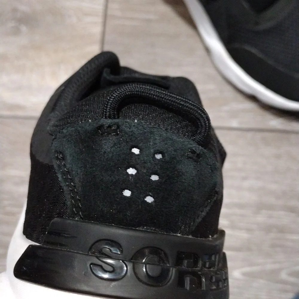 Sorel womens black leather and black mesh sneakers. Mint condition. Size 9